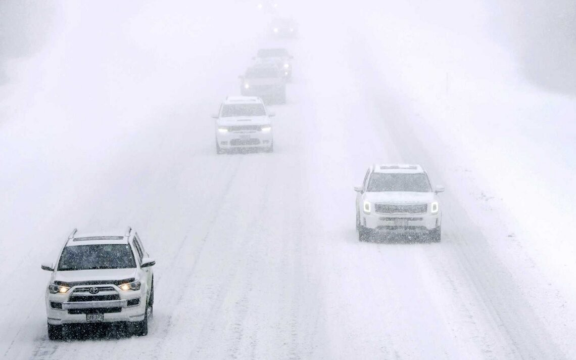 Cars drive on snow covered Interstate 495 North in nearly whiteout conditions during a winter storm in Haverhill.