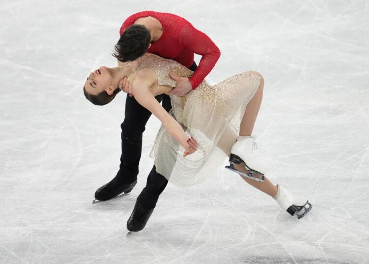 Gabriella Papadakis and Guillaume Cizeron, of France, perform their routine in the ice dance competition during the figure skating at the 2022 Winter Olympics, Monday, Feb. 14, 2022, in Beijing.