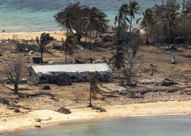 In this photo provided by the Australian Defence Force debris from damaged building and trees are strewn around on Atata Island in Tonga, Jan. 28, 2022, following the eruption of an underwater volcano and subsequent tsunami.