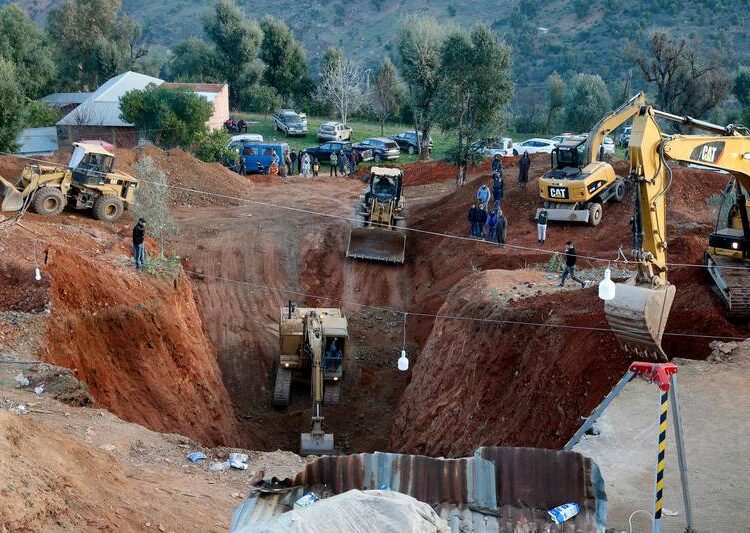 Members of the civil defence use diggers and other equipment in an effort to rescue Rayan, 5, after confirming he was alive.