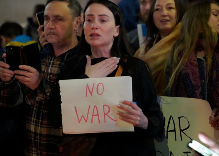 People protest the Russian attack on Ukraine at a demonstration in the Studio City neighborhood of Los Angeles, Thursday, Feb. 24, 2022.