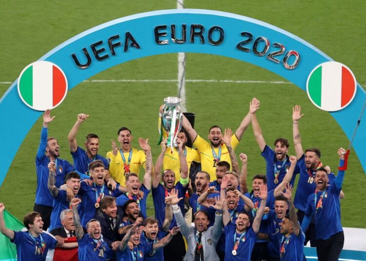 Soccer Football - Euro 2020 - Final - Italy v England - Wembley Stadium, London, Britain - July 11, 2021  Italy celebrate with the trophy after winning Euro 2020 Pool via REUTERS/Catherine Ivill     TPX IMAGES OF THE DAY