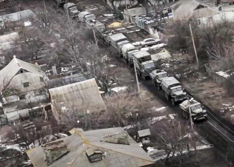 In this photo taken from video released by the Russian Defense Ministry Press Service on Thursday, a view from the window of a Russian military helicopter as it flies over an undisclosed location in Ukraine.