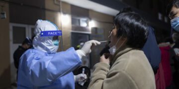 China locks down city of 9 million amid new spike in cases