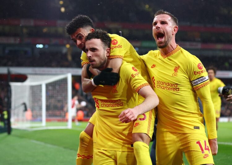 Liverpool sink Arsenal to boost title bid, record-breaker Kane lifts Spurs 1 - Egyptian Gazette Soccer Football - Premier League - Arsenal v Liverpool - Emirates Stadium, London, Britain - March 16, 2022 Liverpool's Diogo Jota celebrates scoring their first goal with Luis Diaz and Jordan Henderson REUTERS/David Klein EDITORIAL USE ONLY. No use with unauthorized audio, video, data, fixture lists, club/league logos or 'live' services. Online in-match use limited to 75 images, no video emulation. No use in betting, games or single club /league/player publications. Please contact your account representative for further details.