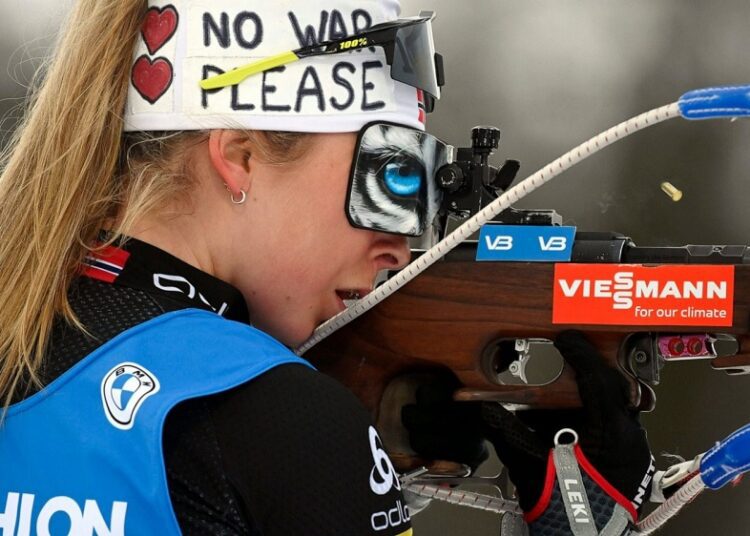 Ingrid Landmark Tandrevold of Norway sports a headband reading No War Please as she competes in the Biathlon 4x6 km relay women's World Cup competition, in Kontiolahti, Finland, on March 3, 2022.