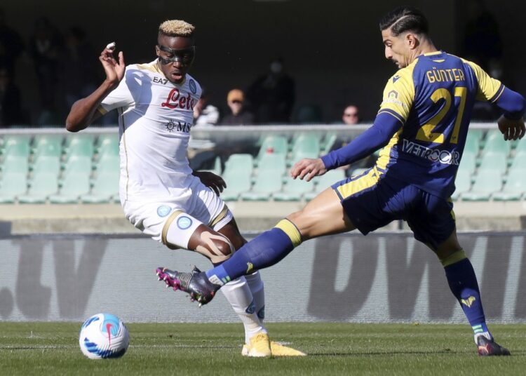Napoli's Victor Osimhen (L) vying for the ball with Verona's Koray Gunter during their Serie A match.