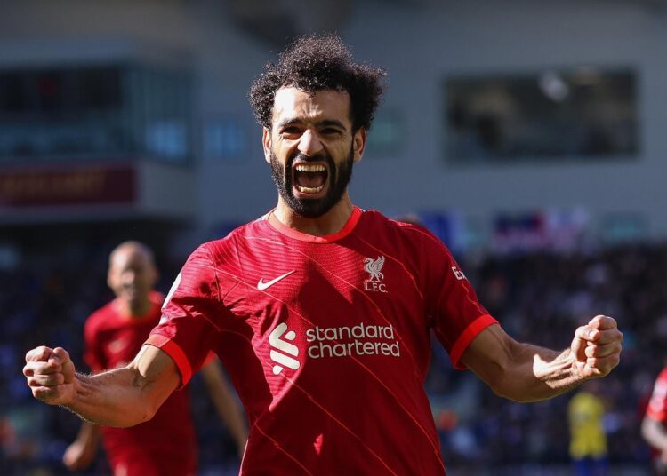 Liverpool's Mohamed Salah celebrates after scoring his side's second goal on a penalty kick during the English Premier League match against Brighton on March 12, 2022