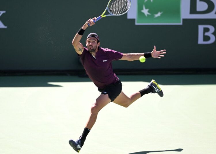 Mar 15, 2022; Indian Wells, CA, USA; Matteo Berrettini (ITA) hits a shot as he defeated Lloyd Harris (RSA) in his third round match at the BNP Paribas Open at the Indian Wells Tennis Garden. Mandatory Credit: Jayne Kamin-Oncea-USA TODAY Sports