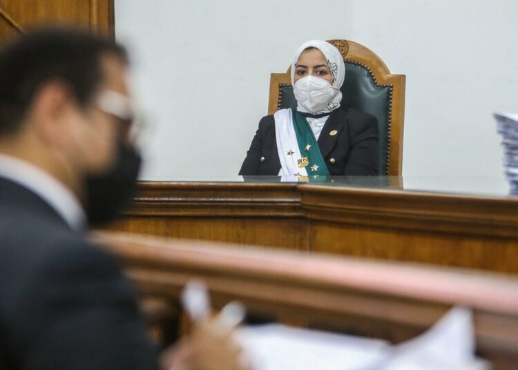 Egyptian female judge Radwa Helmi sits on her first court hearing at the State Council in the capital Cairo.