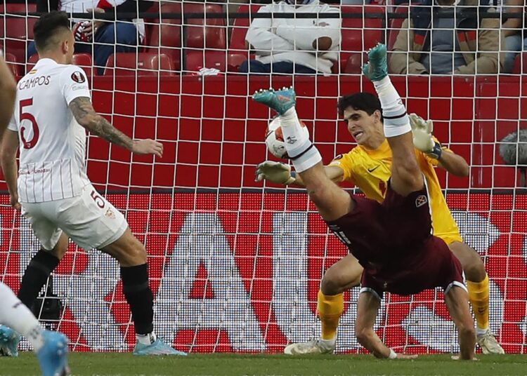 West Ham's Nikola Vlasic dives as he tries to scores against Sevilla's goalkeeper Bono during their UEFA Europa League round of 16 first-leg match in Seville.