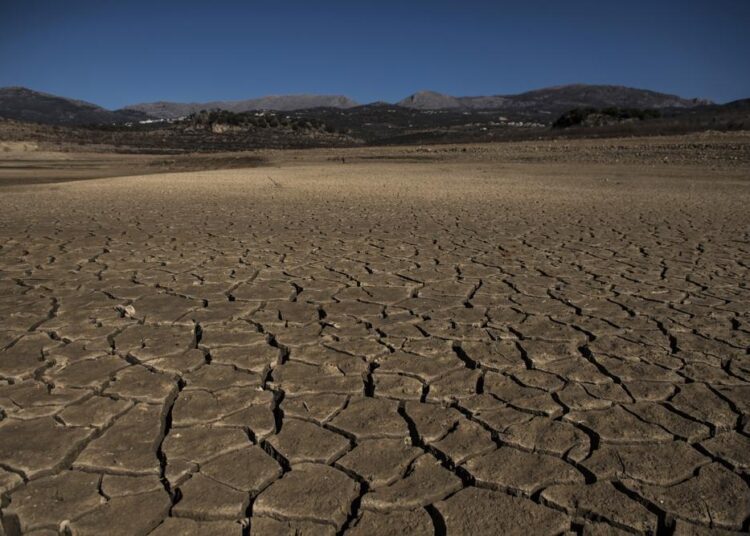 Part of the Vinuela reservoir is seen dry and cracked due to lack of rain in La Vinuela, southern Spain, February 22, 2022.