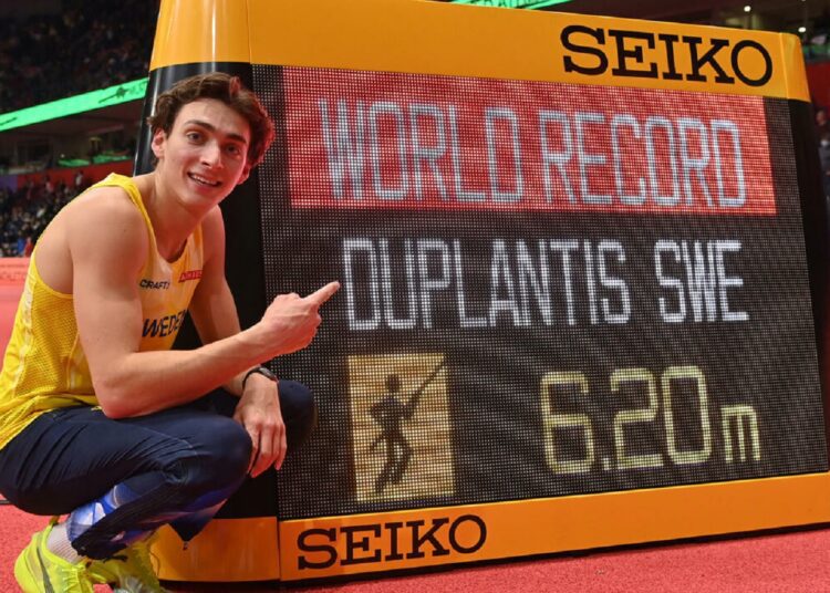 Armand Duplantis poses after setting a new world record at the pole vault events of the World Athletics Indoor Championships in Belgrade.