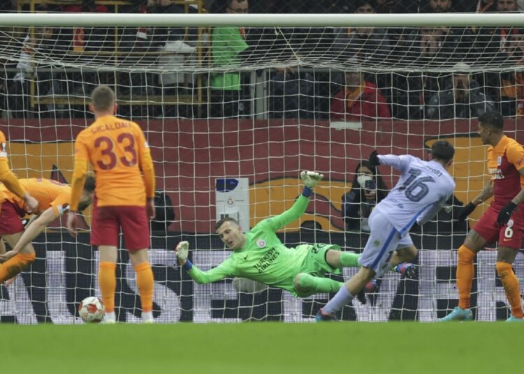 Barcelona's Pedri, second right, scores past Galatasaray's goalkeeper Inaki Pena Sotorres his side's first goal during their Europa League round of 16 second leg match.