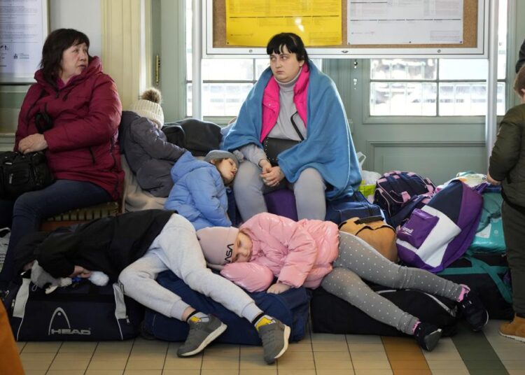 Ukraine says Russia seized relief workers in Mariupol convoy 1 - Egyptian Gazette Children from Ukraine sleep at a railway station in Przemysl, southeastern Poland, on Wednesday, March 23, 2022.