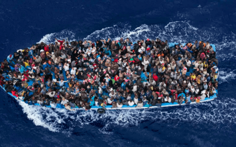 At least 9 migrants drown, 9 rescued off Tunisian coast 1 - Egyptian Gazette A file photo of a boat carrying migrants in the Mediterranean.