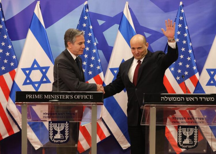 Israeli PM tests positive for Covid, is working from home 1 - Egyptian Gazette Israeli Prime Minister Naftali Bennett, right, and U.S. Secretary of State Antony Blinken shake hands during a press statement after their meeting at the prime minister's office in Jerusalem, Sunday, March 27, 2022.