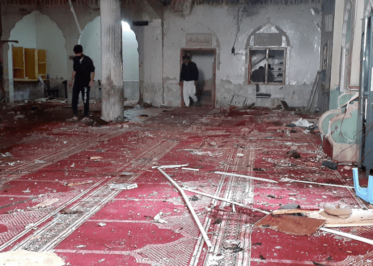 Rescue workers and volunteers gather at the site of bomb explosion in Peshawar, Pakistan, Friday, March 4, 2022.