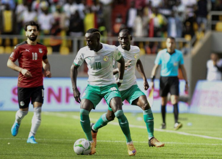 Senegal's Sadio Mane (C) controls the ball during the World Cup 2022 qualifying football match between Senegal and Egypt at the  Me Abdoulaye Wade Stadium in Diamniadio.