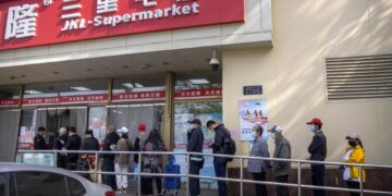 Beijing enforces lockdowns, expands Covid mass testing