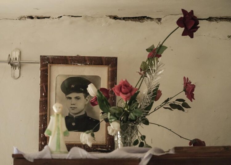 Ukraine appeals for weapons as fight looms on eastern front 1 - Egyptian Gazette A family picture hangs on a wall in the house of Tetiana Oleksiienko, a resident of the village of Andriivka, Ukraine, heavily affected by fighting between Russian and Ukrainian forces, Wednesday, April 6, 2022. Several buildings in the village were reduced to mounds of bricks and corrugated metal and residents struggle without heat, electricity or cooking gas.