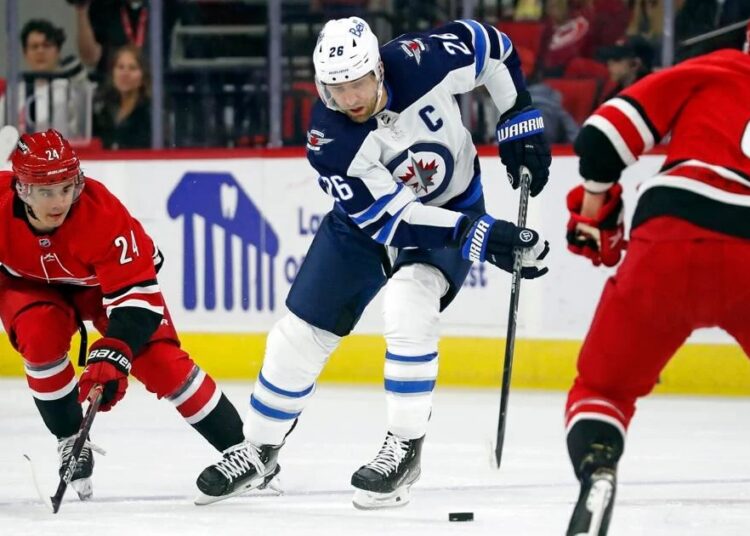 Jarvis helps Hurricanes rally to beat Jets 1 - Egyptian Gazette Winnipeg Jets' Blake Wheeler (C) controls the puck between Carolina Hurricanes' Seth Jarvis (L) and Martin Necas during the first period of an NHL hockey game in Raleigh.