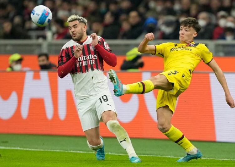 AC Milan's Theo Hernandez (L) and Bologna's Aaron Hickey challenge for the ball during their Serie A match in Milan.