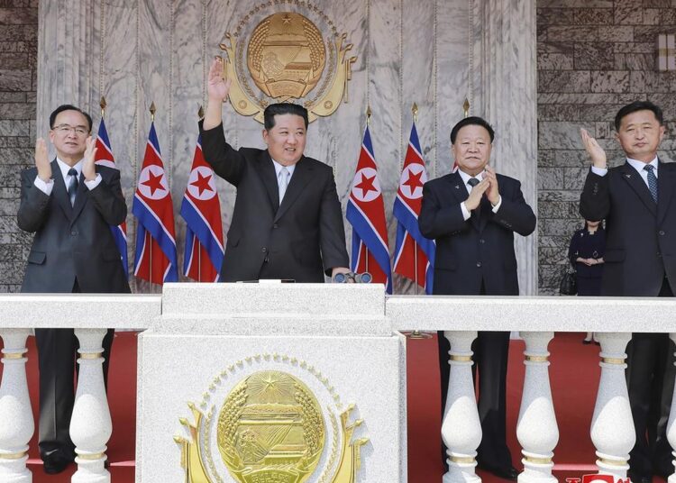 In this photo provided by the North Korean government, North Korean leader Kim Jong Un, center, attends a parade to celebrate the 110th birth anniversary of its late founder Kim Il Sung, at the Kim Il Sung Square in Pyongyang, North Korea on April 15, 2022.