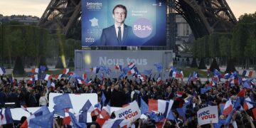 Macron cruses Le Pen