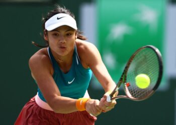 Raducanu overcomes early stutter on Madrid clay