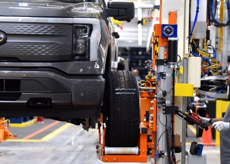 Ford loses $3.1 billion, hit by investment and chip shortage 1 - Egyptian Gazette A Ford F-150 electric truck is displayed at the Rouge Electric Vehicle Center, in Dearborn.
