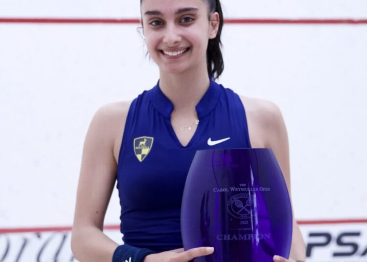 Rowan el-Araby posing with the trophy of the Carol Weymuller Squash Open.