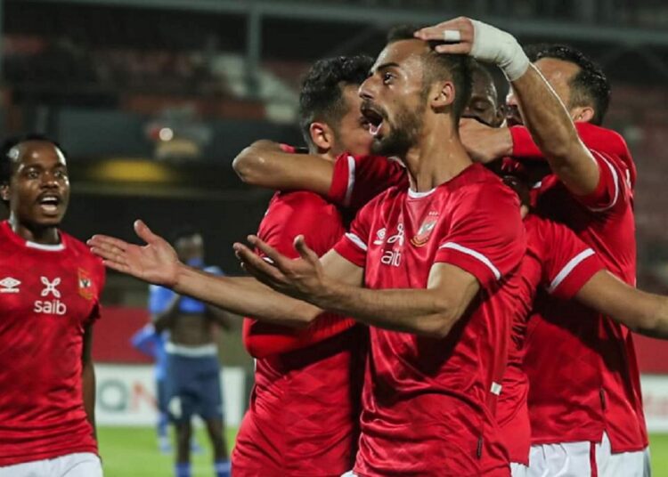 Al-Ahly players celebrating after scoring against Al-Hilal during their CAF Champions League match.