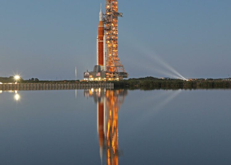 NASA begins critical final test on mega Moon rocket 1 - Egyptian Gazette The massive Artemis I rocket is illuminated at dusk atop a mobile launch platform en route to Launch Pad 39B from the Vehicle Assembly Building at the Kennedy Space Center in Florida.