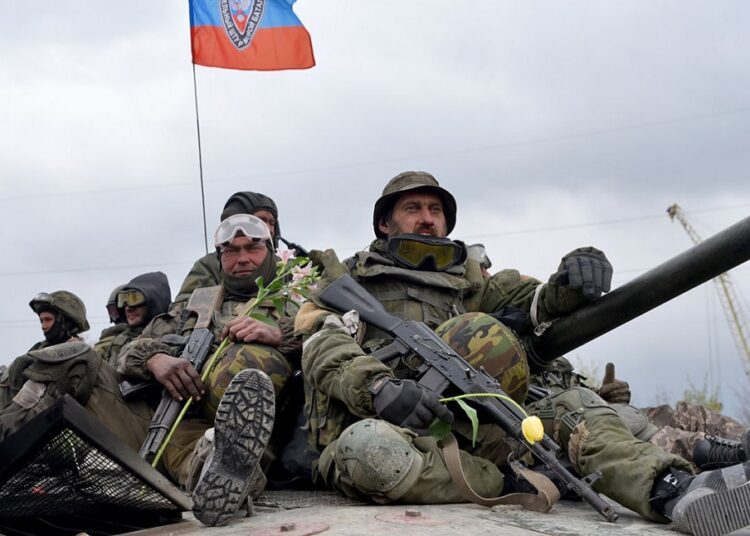 Servicemen of the Somalia Battalion unit returning from Mariupol, are seen during a welcoming ceremony in Donetsk.