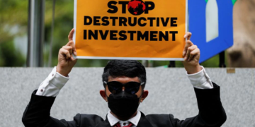 On Earth Day, climate activists rally against fossil fuels