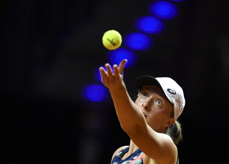Poland's Iga Swiatek serves to Germany's Eva Lys (not in the picture) during their single match of the Women's Tennis Grand Prix WTA 500 tournament in Stuttgart, southwestern Germany.