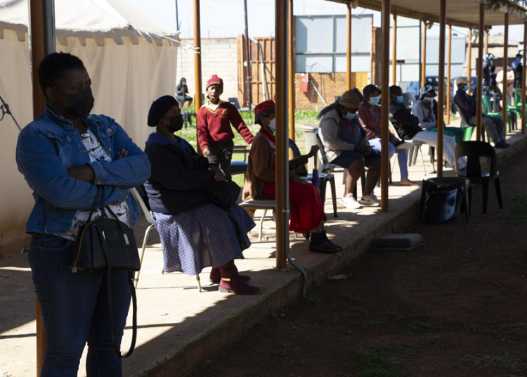People queue at a COVID-19 testing centre in Soweto, South Africa on May 11, 2022.