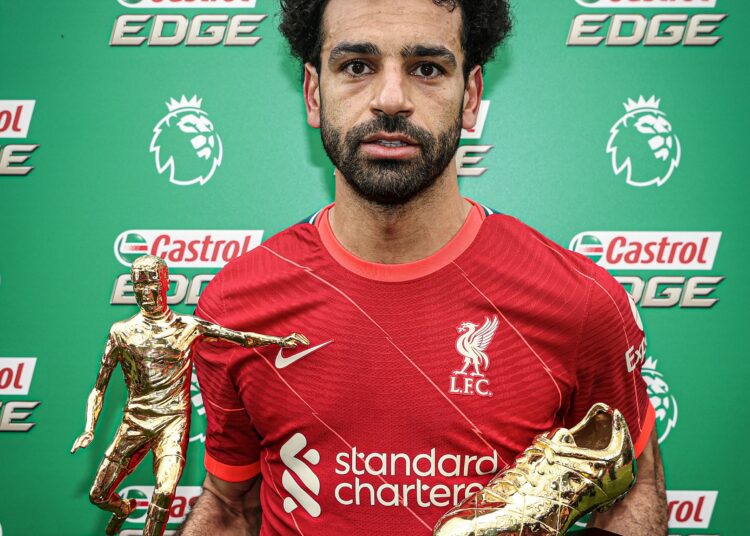 Salah ends Premier League with Golden Boot and Playmaker awards 1 - Egyptian Gazette Liverpool’s Egyptian midfielder Mohamed Salah celebrates with his two trophies golden boot and playmaker of the year.