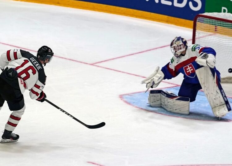 Morgan Geekie of Canada scores his side's 5th goal during their group A Hockey World Championship match against Slovakia in Helsinki, Finland.