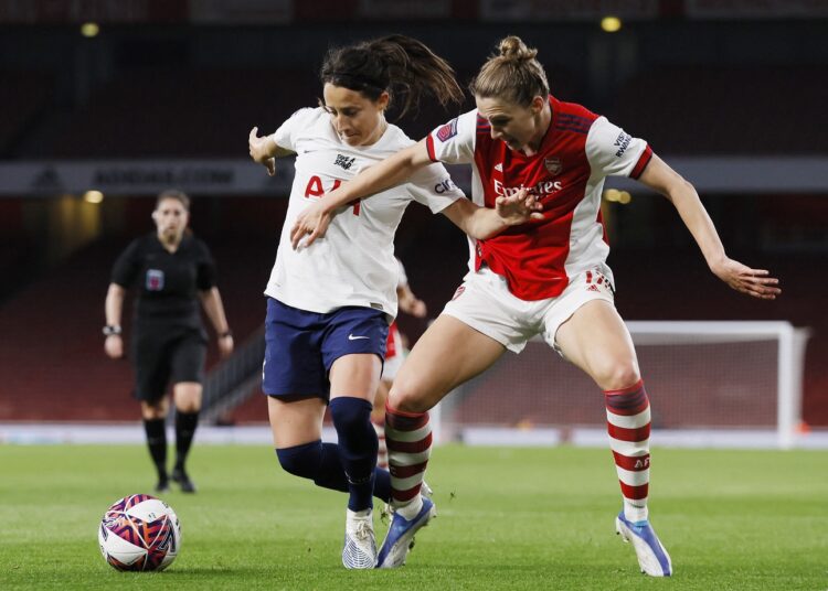 Arsenal's Vivianne Miedema (R) in action with Tottenham Hotspur's Maeva Clemaron at the Emirates Stadium in London.