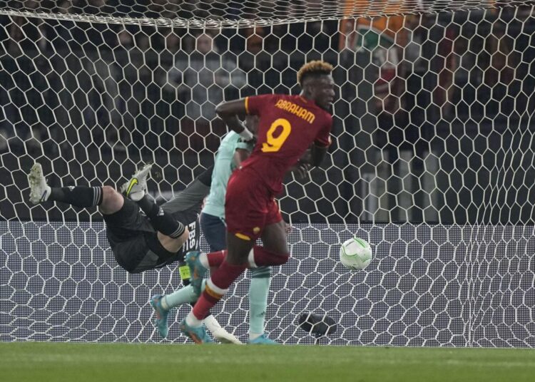 Roma's Tammy Abraham scores his side's first goal during a Conference League semi-final second leg match against Leicester City, at Rome's Olympic Stadium.