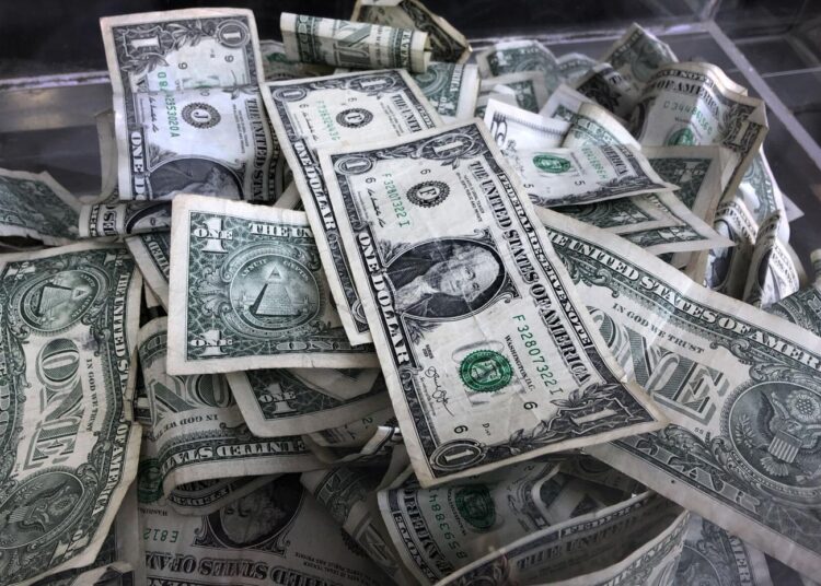 How to save more when inflation makes your money count less 1 - Egyptian Gazette In this April 3, 2019, photo a tip box is filled with US currency in New York. During inflation, consumers can adjust their spending and saving strategies to help lessen the impact that inflation has on the value of their money.