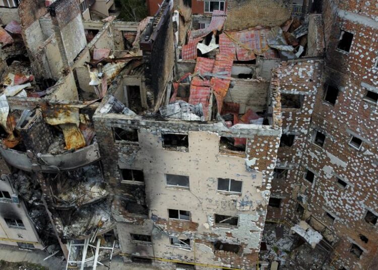 Damaged buildings ruined by attacks are seen in Irpin, on the outskirts Kyiv, Ukraine, Thursday.