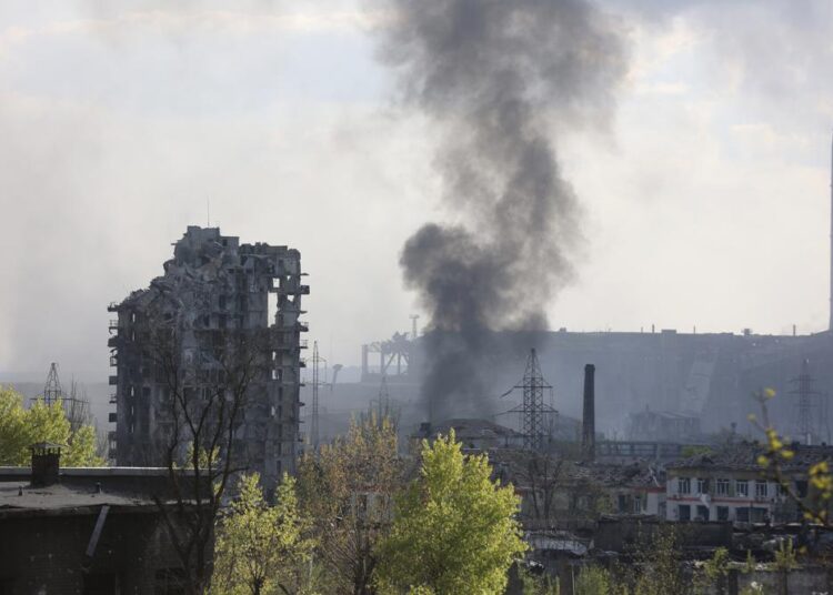 Easy out from steel mill seen as unlikely for Ukraine troops 1 - Egyptian Gazette FILE - Smoke rises from the Azovstal steel mill in Mariupol, in territory under the government of the Donetsk People's Republic, eastern Ukraine, yesterday.