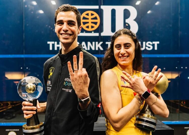 Ali Farag and Nour el-Sherbini posing with the 2022 World Championship trophies.
