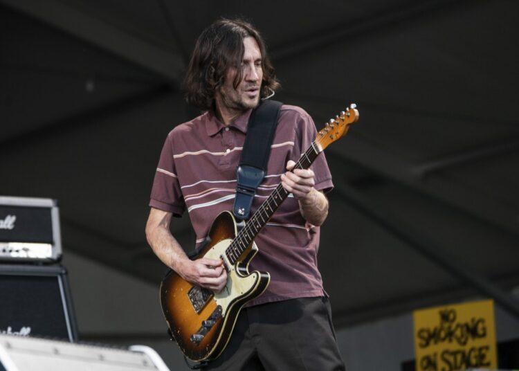 Chili Peppers honour Foo Fighters drummer at Jazz Fest 1 - Egyptian Gazette John Frusciante of the Red Hot Chili Peppers performs at the New Orleans Jazz and Heritage Festival in New Orleans.