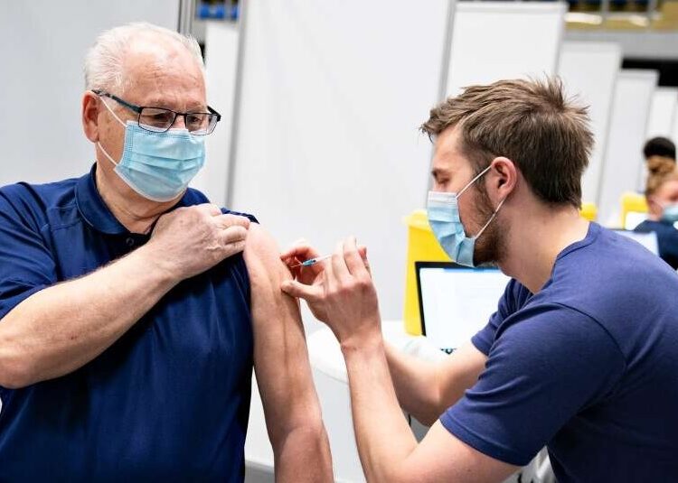 Denmark to destroy excess soon-to-expire COVID-19 vaccines 1 - Egyptian Gazette A person receives their covid-19 vaccine in Frederikshavn in Jutland, Denmark, on April 12, 2021.