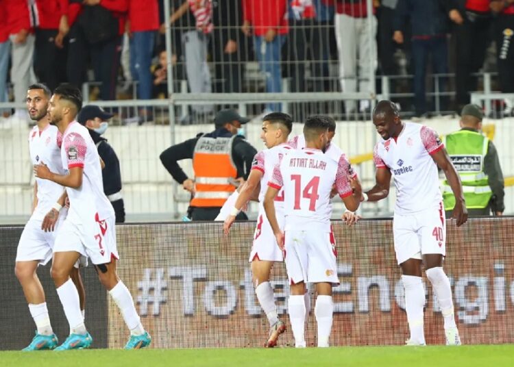Wydad Athletic players celebrating after scoring against Petro de Luanda at the Mohammed V Stadium.