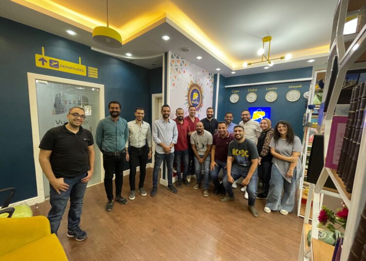Shop till someone else drops through app 1 - Egyptian Gazette Mohamed ElGohary, (3rd R), founder of VoyShip application ,posing in the photo with the team behing the operations and management.